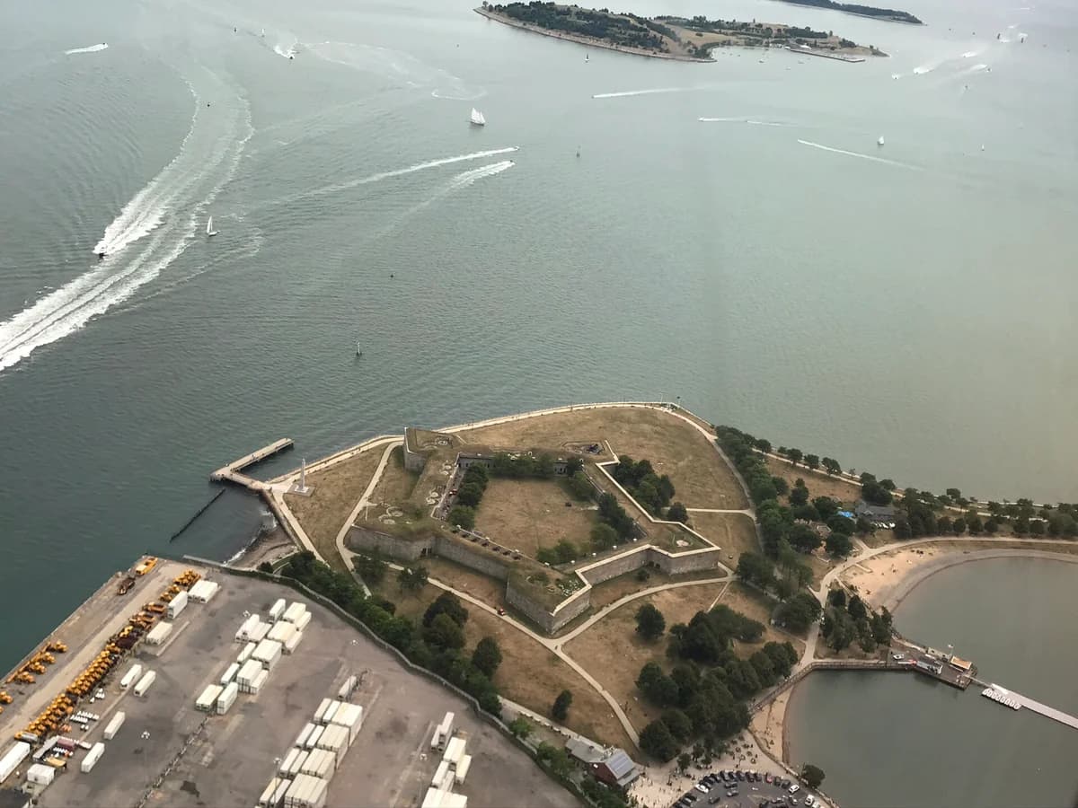 Aerial view of the star shaped granite walls of Fort Independence on Castle Island, with Pleasure Bay, its beach and Boston Harbor around it