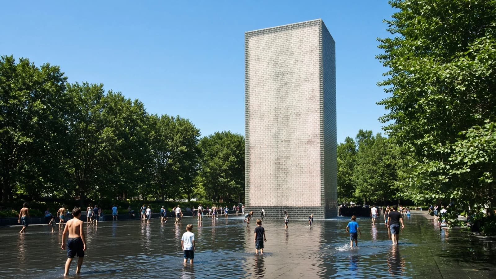 Crown Fountain glass tower in Millennium Park with kids wading in the shallow pool