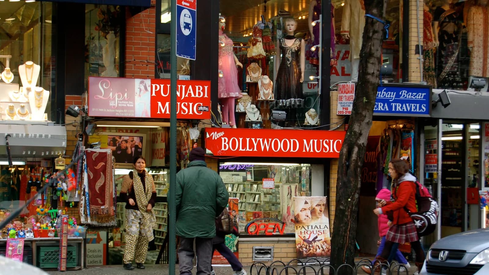 South Asian shopfronts in Jackson Heights, Queens, with Punjabi and Bollywood music stores, sari mannequins and jewelry windows