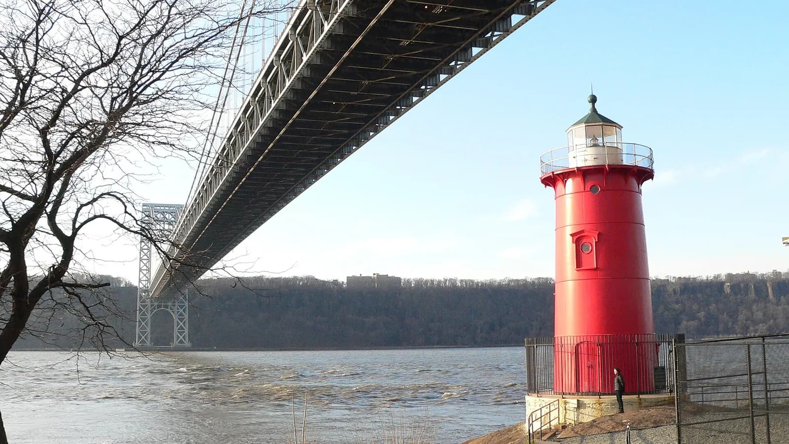 The Little Red Lighthouse on the Hudson River shore below the George Washington Bridge