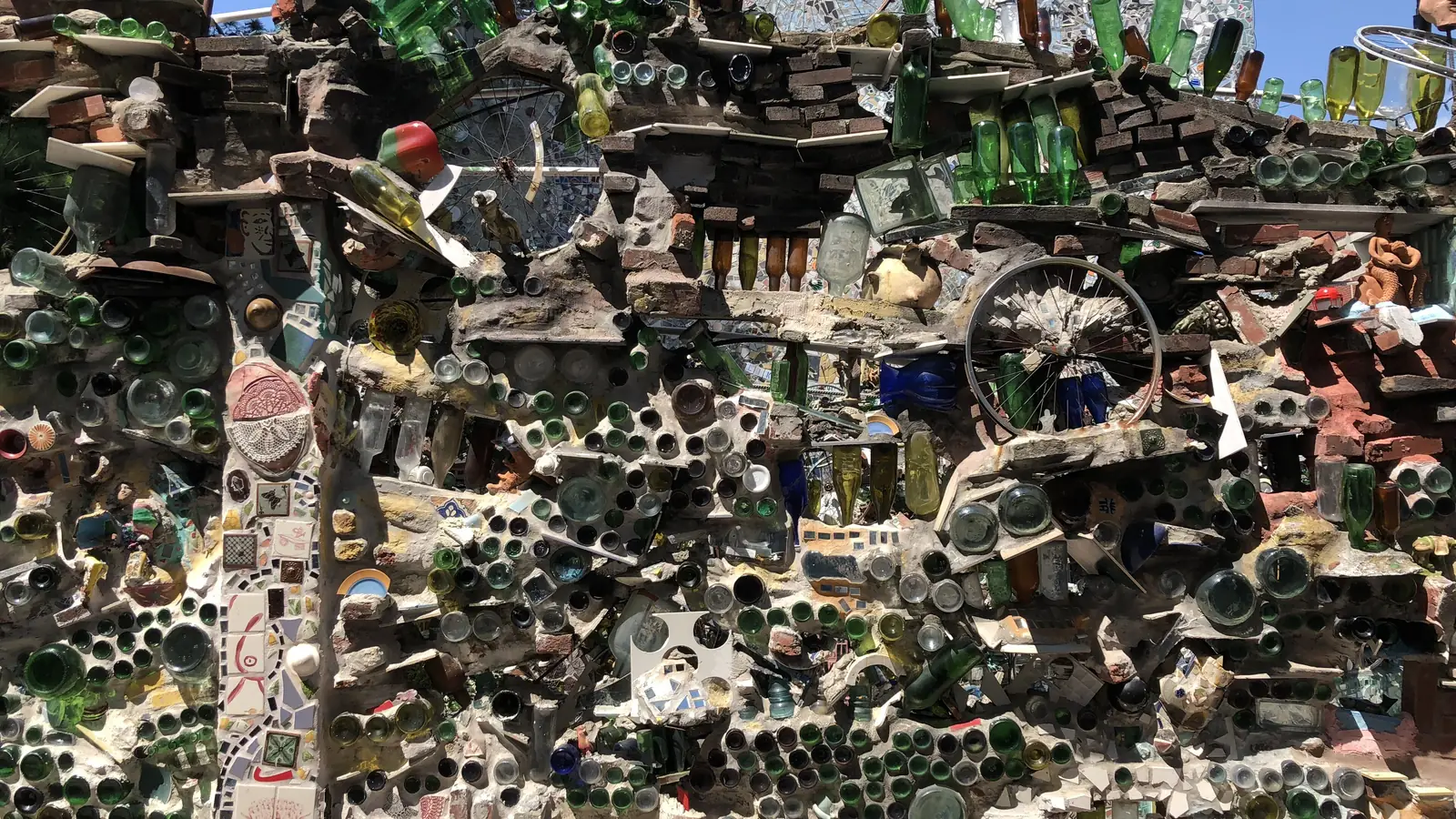 Walls of colorful bottles, tiles and mirror shards at Philadelphia's Magic Gardens on South Street